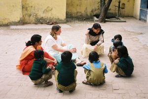 volunteers working with a small group at the primary school