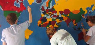 volunteers painting a mural